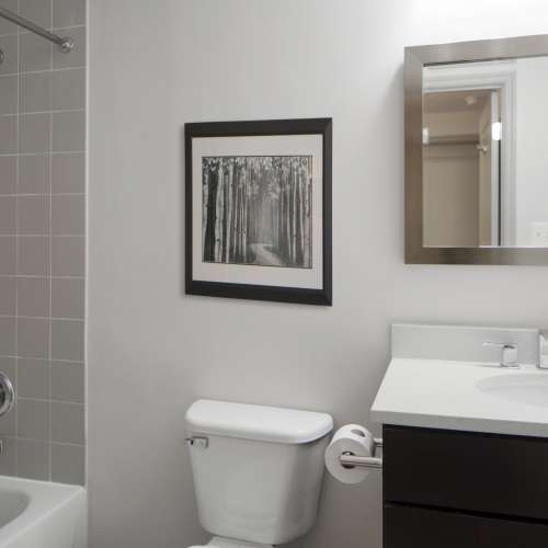 High-end finishes are continued into the renovated baths for a cohesive home