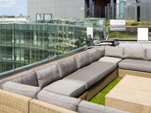 Multiple seating areas in sun and shade, create inviting, varied environments for entertaining.