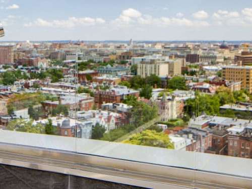 Explore the reaches of Washington's monumental skyline through a pair of vintage U.S. Naval binoculars.