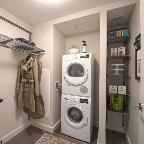Ample storage with a separate area for in unit washer and dryer.