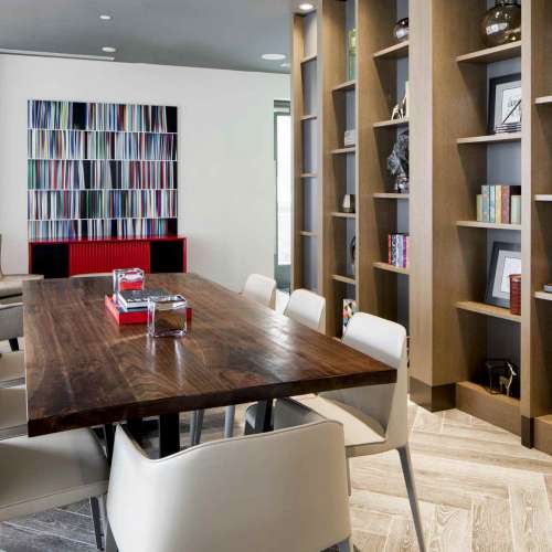 A curated collection of books, the library can be configured into a grand dining room for a formal dinner or an elaborate brunch, offering meal seating for 16.
