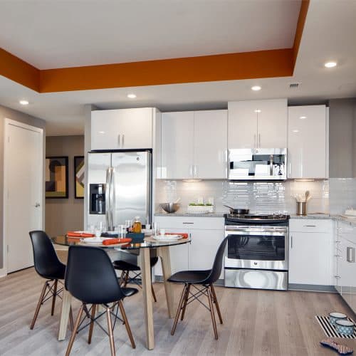 Stunning kitchens with designer white cabinetry with pantries and under-counter lighting.