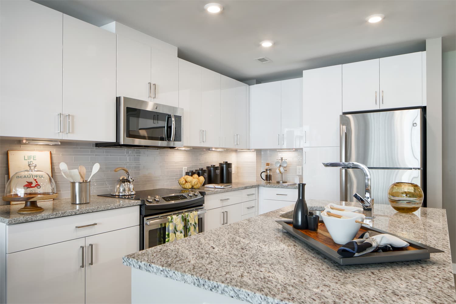 Insignia on M : Cook and entertain in our gourmet kitchens with stone countertops, glass-tile backsplashes, and stainless steel GE®  ENERGY STAR® appliances.