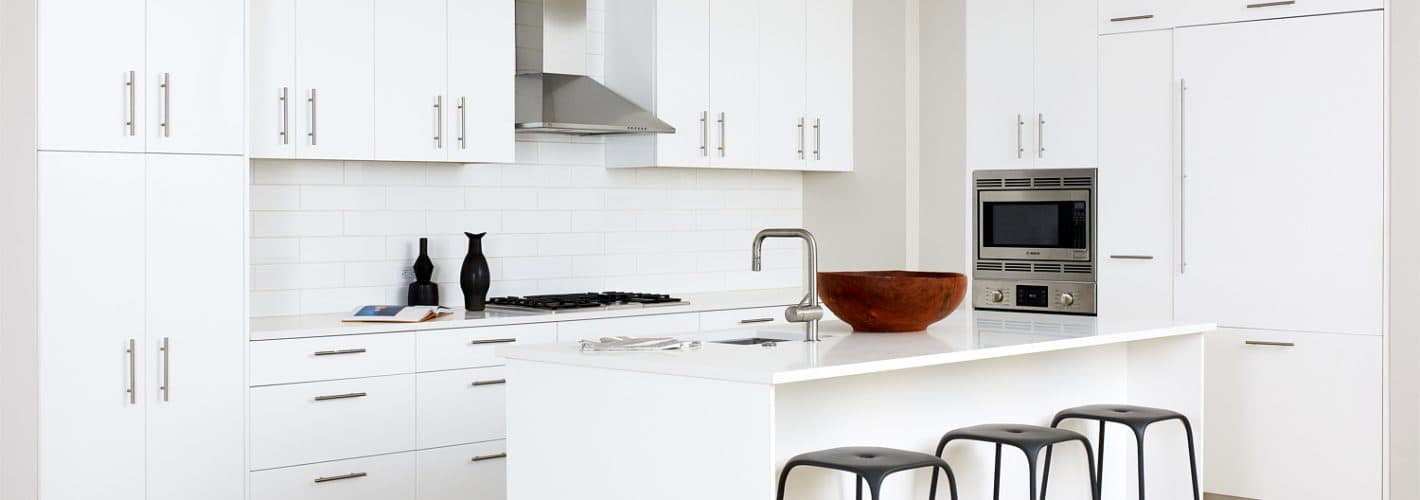 The Residences at Eastern Market : Savor european-inspired, all white flat-front wood cabinets.