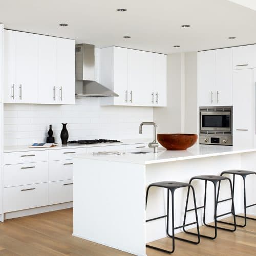 The Residences at Eastern Market : Savor european-inspired, all white flat-front wood cabinets.