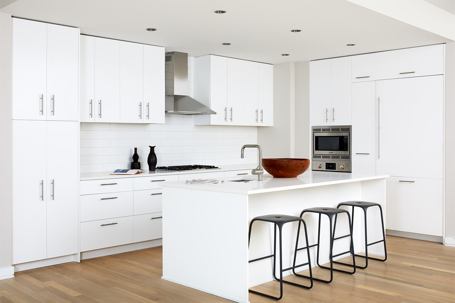 The Residences at Eastern Market : Savor european-inspired, all white flat-front wood cabinets.