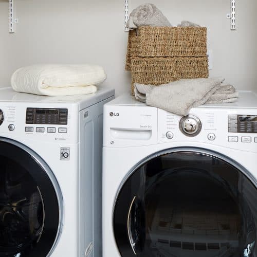 Walk-in laundry rooms with full size LG appliances.