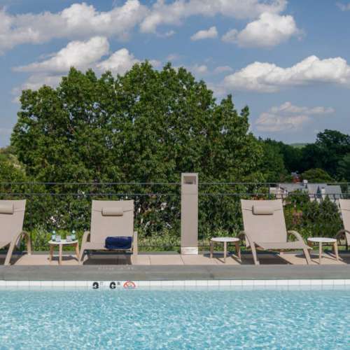 Enjoy a sunny afternoon by the rooftop pool.