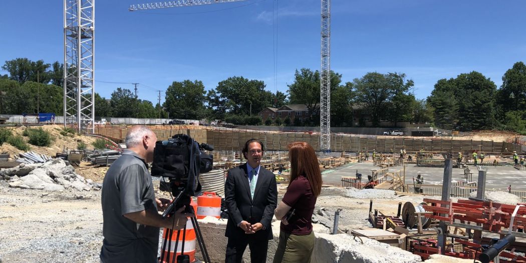 Toby Bozzuto & interview crews at Chevy Chase Lake construction site.