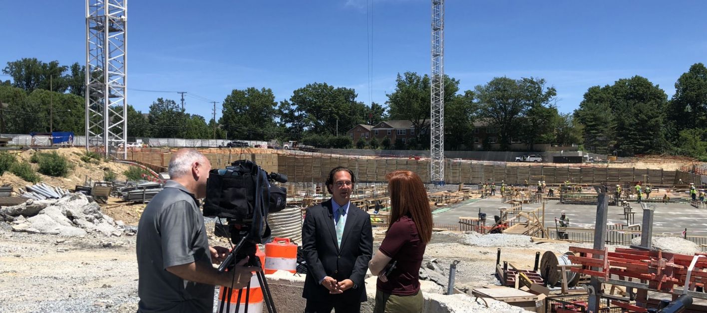 Toby Bozzuto & interview crews at Chevy Chase Lake construction site.