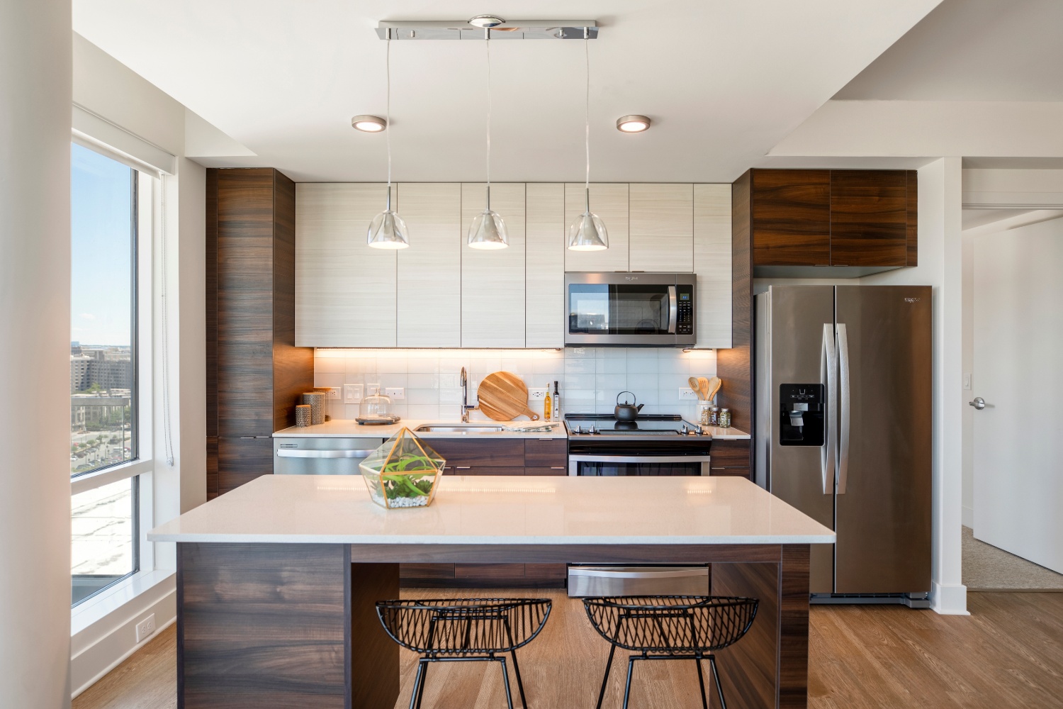 The Witmer : Darkwood cabinets and white granite on stainless steel