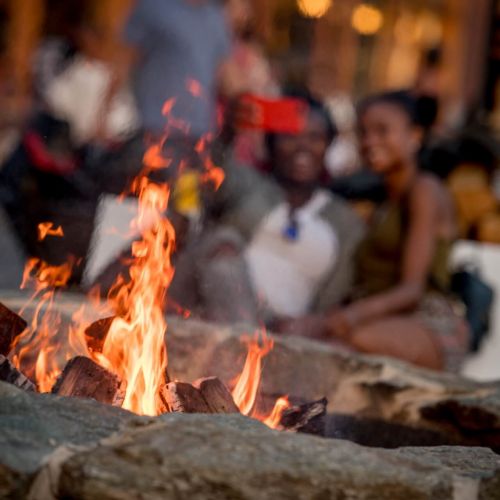 Gather around the fire and enjoy an evening with neighbors and friends on the popular District Pier.