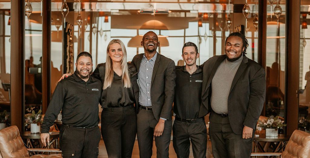 Group of Bozzuto team members at a lobby.