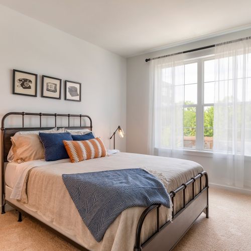 Spacious bedroom with natural light.