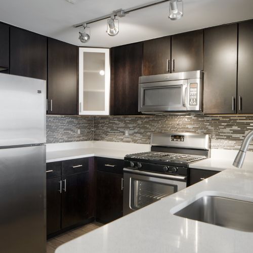 Gorgeous tile backsplash compliments the contemporary design 