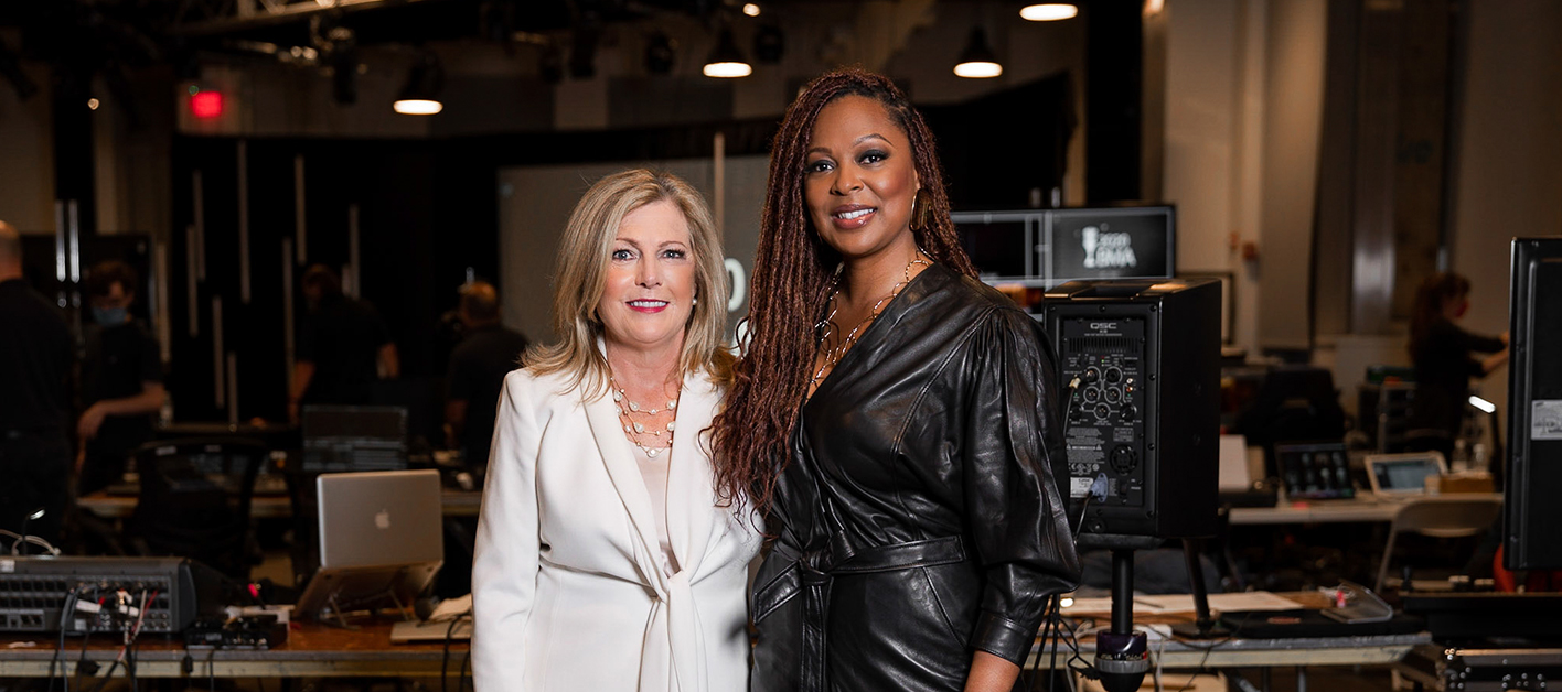 Bozzuto executives Julie Smith & Stephanie Williams in a recording studio