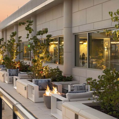 Unwind by the fire on our rooftop amenity space.