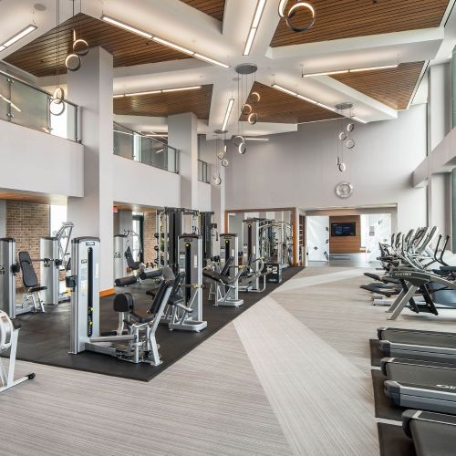 Penthouse-level fitness center with floor-to-ceiling windows and see-for-miles panoramas