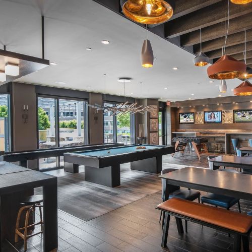 The ultimate hangout with HDTV sports wall, kitchen, billiards, shuffleboard, and foosball