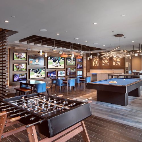 Relax and kick back in clubroom with HDTV sports wall, kitchen, billiards, shuffleboard, and foosball