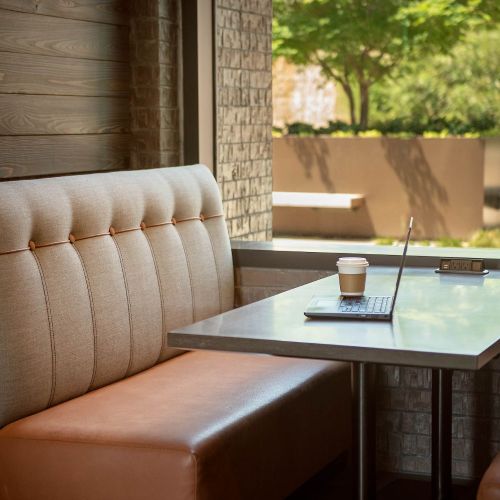 Cyber nooks with banquettes and powered tables