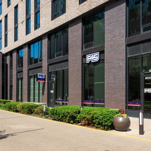 Ground-level retail featuring F45, a workout training facility