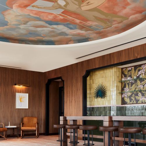 Discover The Wray's rooftop penthouse club, featuring a residential lounge, bar, and private meeting room. 