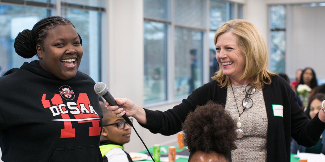 Julie Smith, Chief Administrative Officer of Bozzuto, engaging with a workshop participant.