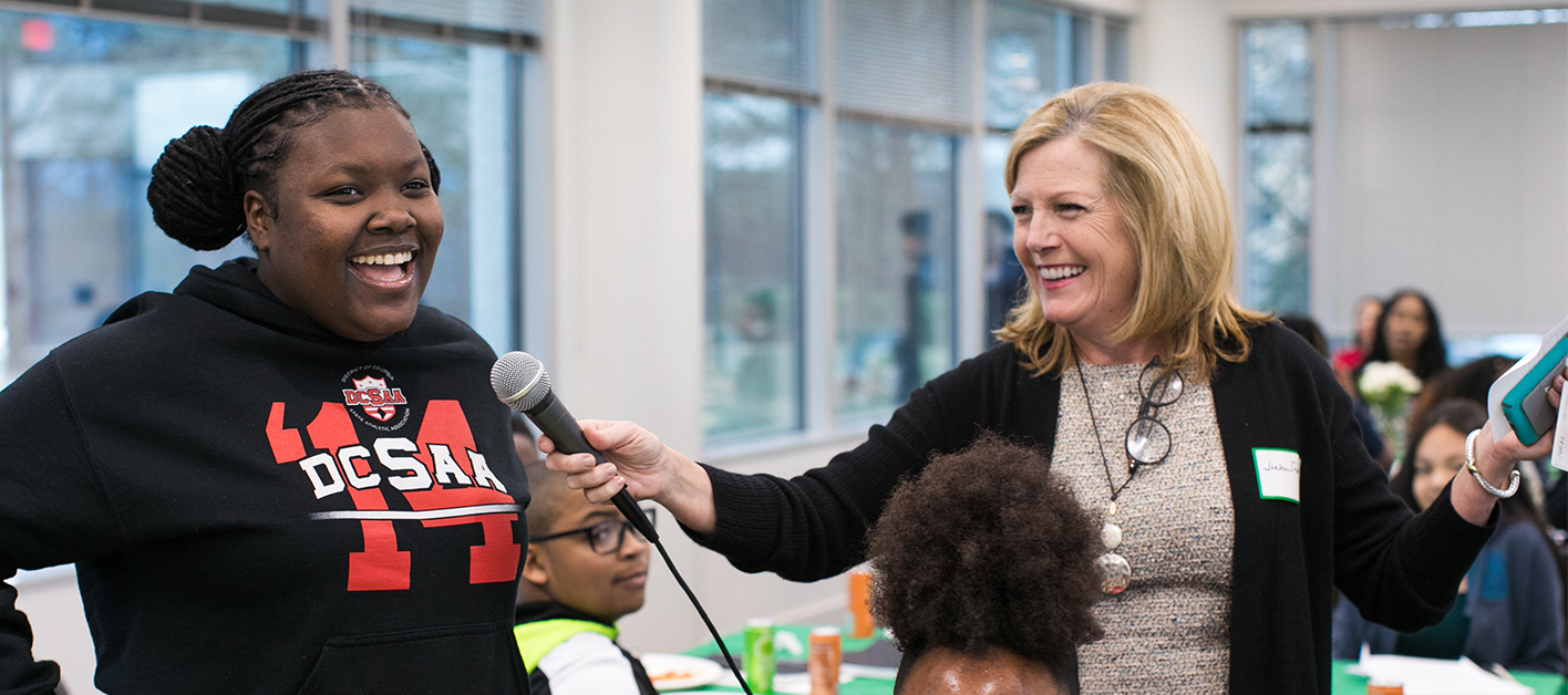Julie Smith, Chief Administrative Officer of Bozzuto, engaging with a workshop participant.