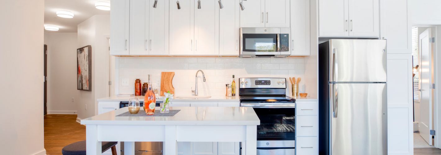 Array at West Alex : Bright cabinetry and stainless steel appliances 