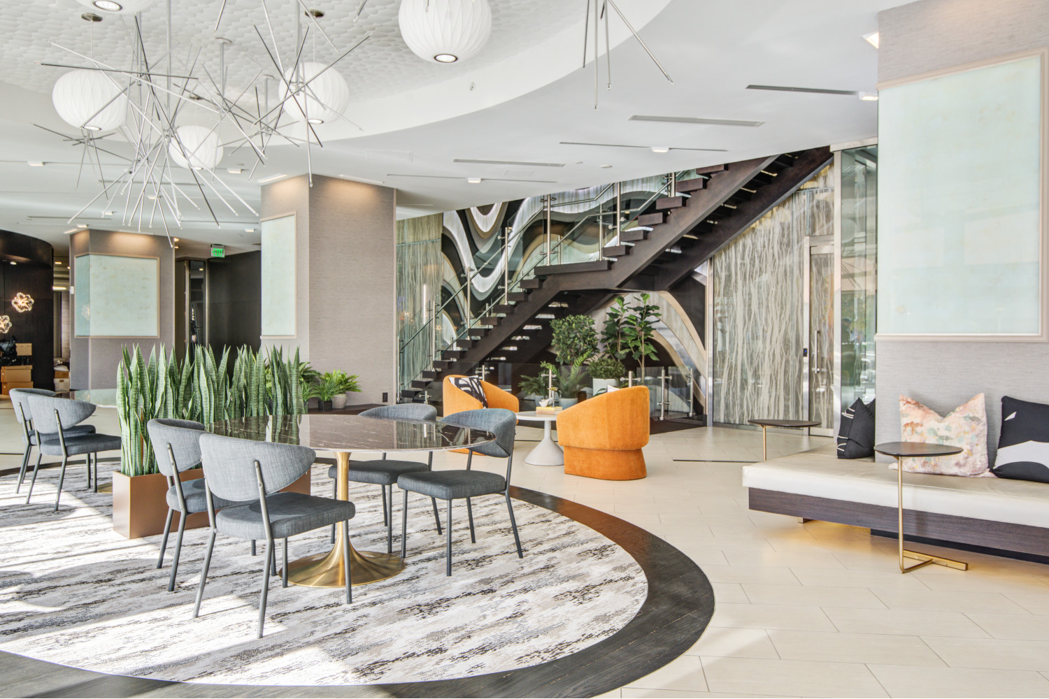 Elevation at Washington Gateway : Lobby with lounging areas, grand staircase and mixed media art wall