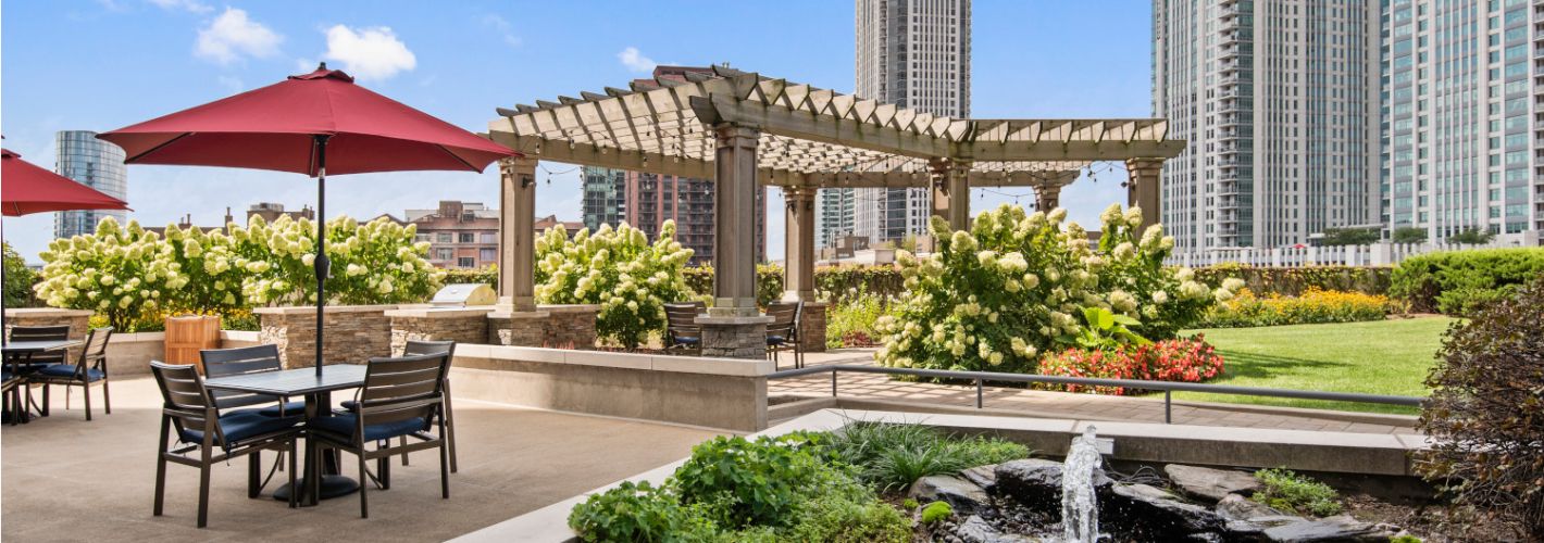 Left Bank : Spacious, landscaped outdoor terrace with lush seating, grills and a fire pit