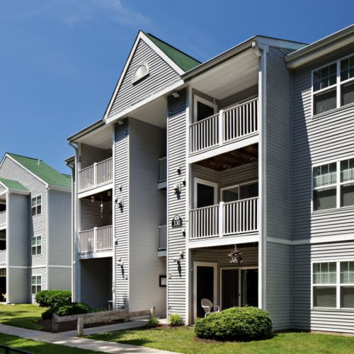 Exterior view of Silverwood Farm apartments and professionally landscaped grounds.