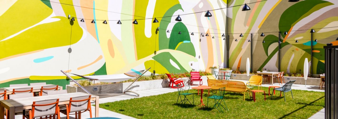 The Vale : Hang out and snap a selfie in front of our colorful courtyard mural. 