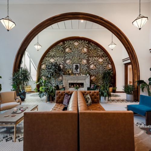 Expansive two-story Great Room with fireplace lounge and communal bar area