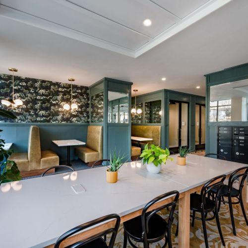 Flexible co-working lounge with collaboration booths, work pods, and printing station