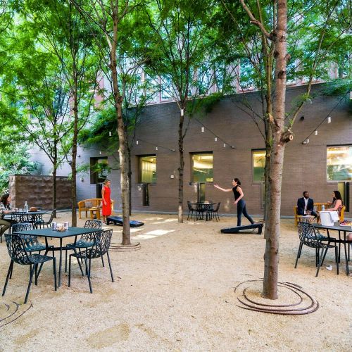 Quaint, landscaped courtyards with tables and outdoor games