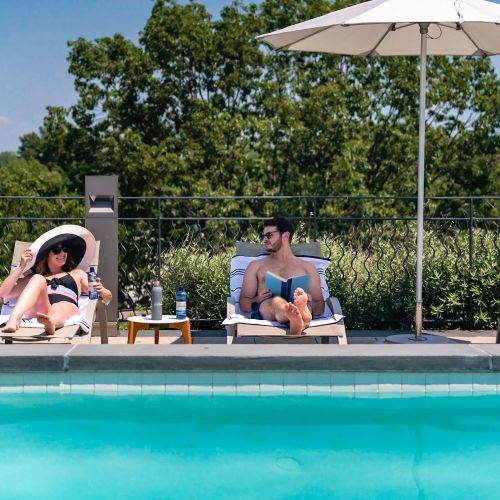 Stay cool by the pool beneath our outdoor patio umbrellas. 