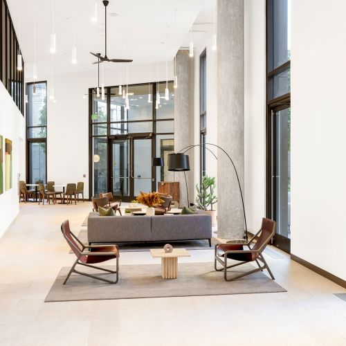 Modern indoor-outdoor lobby with views to the courtyard