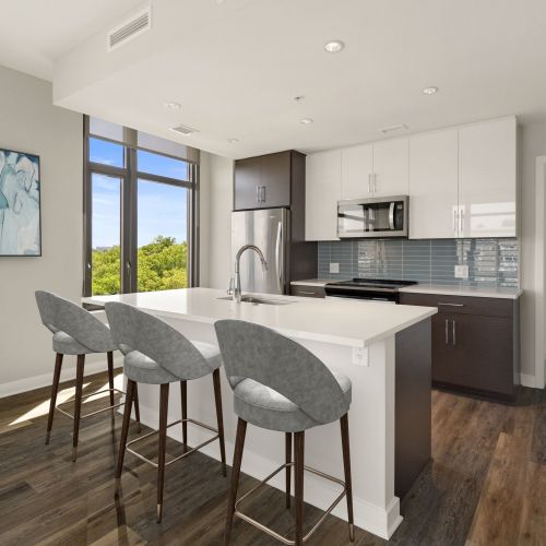 The Lindley features kitchen countertops, backsplashes and cabinetry in 2 styles