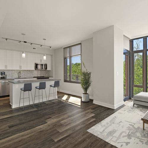 Luxe, wide-plank flooring in kitchens and living areas