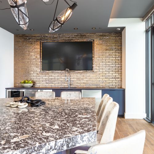 Unwind at the luxury rooftop wet bar featuring a wine dispensing station