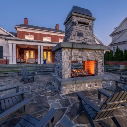 The outdoor fireplace warms up cool nights.