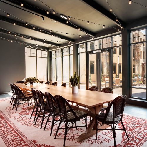 Meeting areas adorned with quaint café lighting courtyard views