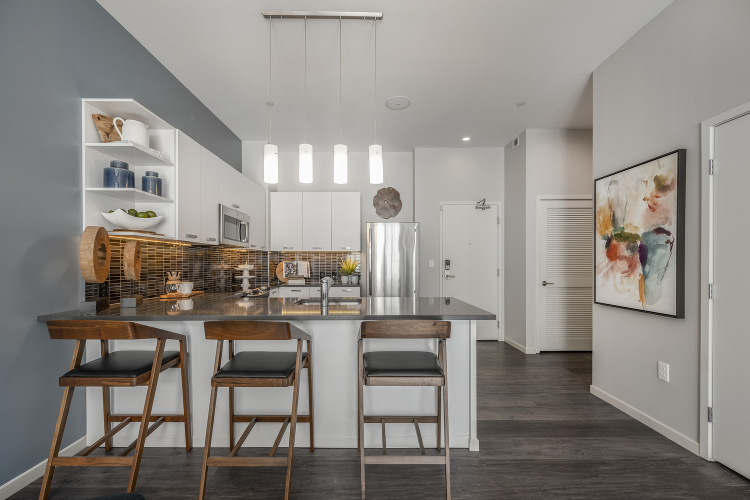 Kitchen and front door view in apartments.