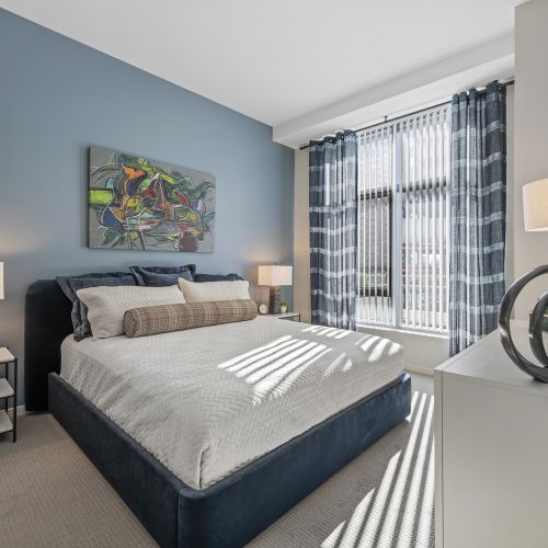 Angled view of bedroom in apartments.