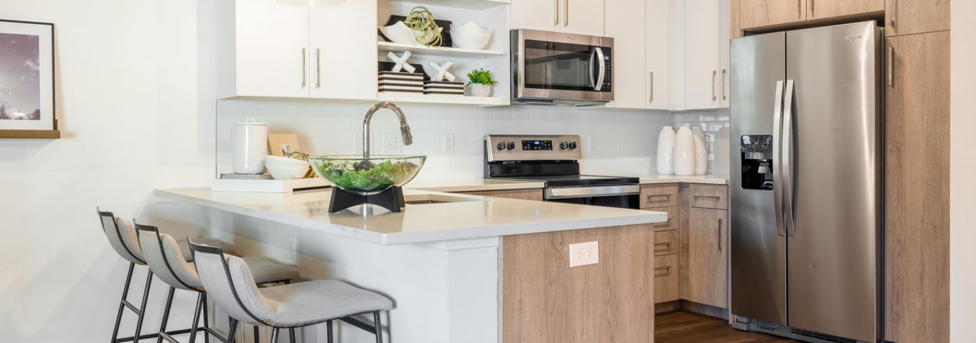 Compass at The Grove : Sleek contemporary cabinetry with modern stainless steel appliances