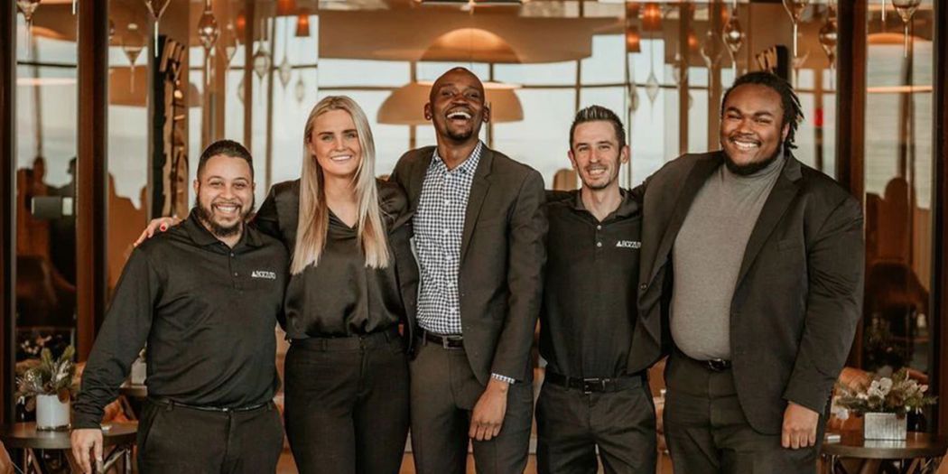 Group of Bozzuto team members at a lobby.
