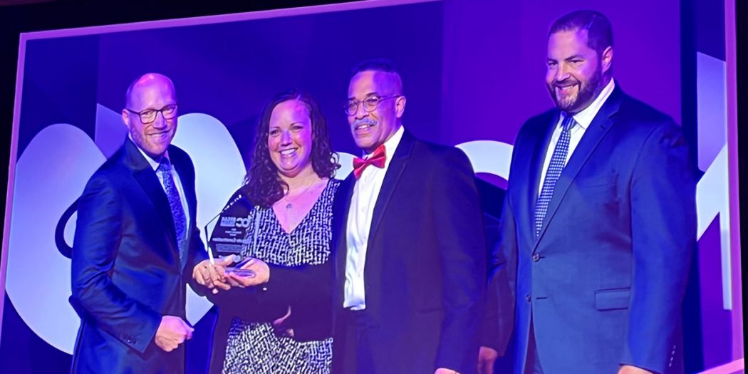 Bozzuto representatives accepting the 2022 Corporate Impact Award by So Others Might Eat (SOME).