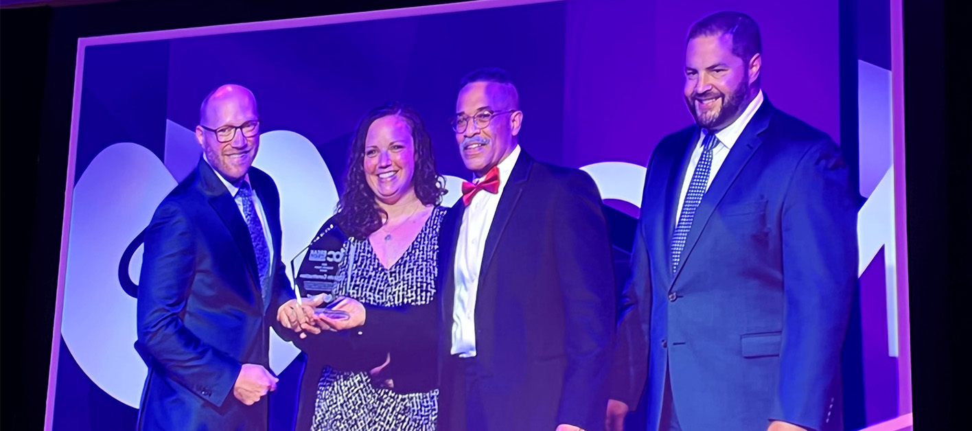 Bozzuto representatives accepting the 2022 Corporate Impact Award by So Others Might Eat (SOME).